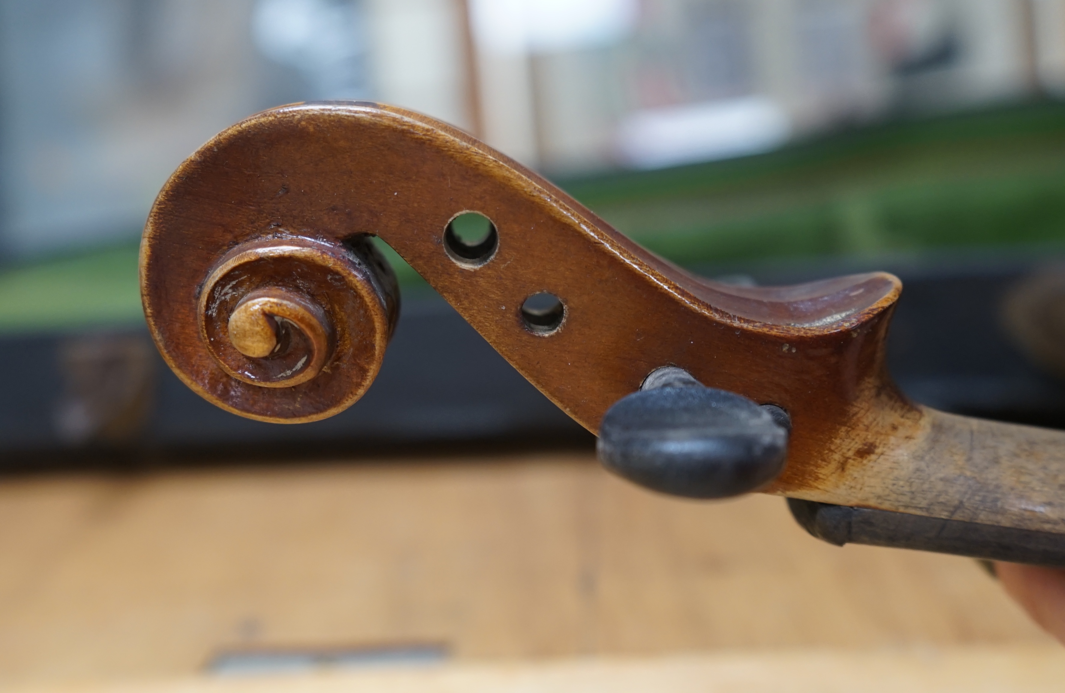 Early 20th century ¾ size violin, unlabelled, cased, together with a violin table, back and scroll. Condition - fair